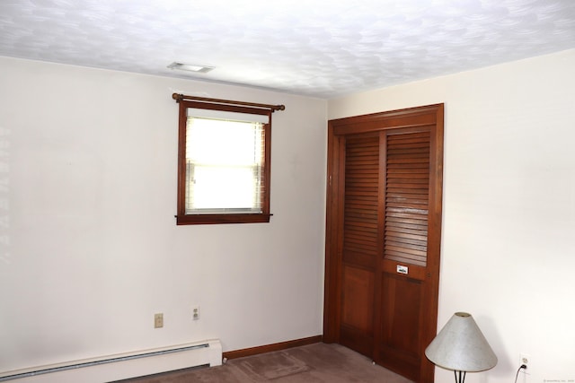 1 Sunrise Cir, Enfield, CT 06082 - unfurnished bedroom with a closet, a baseboard heating unit, baseboards, carpet floors, and visible vents