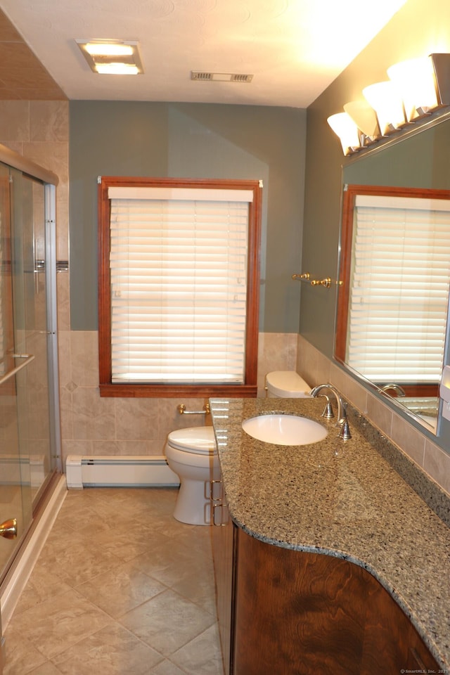 1 Sunrise Cir, Enfield, CT 06082 - full bathroom with tile walls, a stall shower, toilet, visible vents, and a baseboard radiator