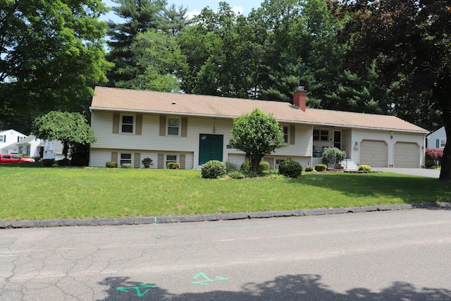 1 Sunrise Cir, Enfield, CT 06082 - raised ranch featuring a front lawn, a garage, a chimney, and driveway