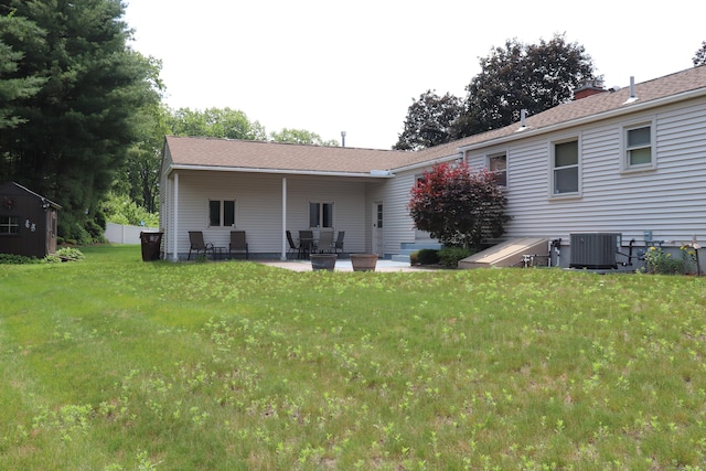 1 Sunrise Cir, Enfield, CT 06082 - rear view of property featuring a patio and a yard