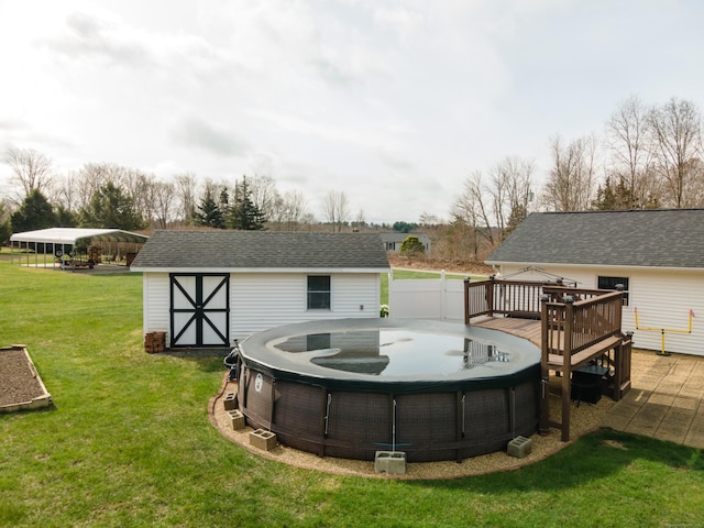 17 Old Hampton Rd, Canterbury, CT 06331 - view of green lawn with a deck, an outdoor structure, and a storage unit