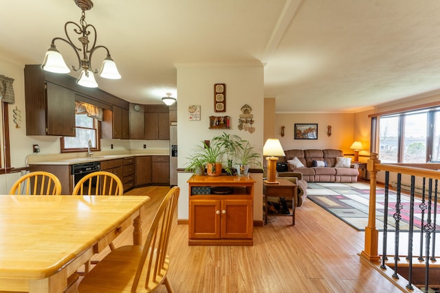 17 Old Hampton Rd, Canterbury, CT 06331 - dining space featuring crown molding, light wood-style flooring, and a chandelier