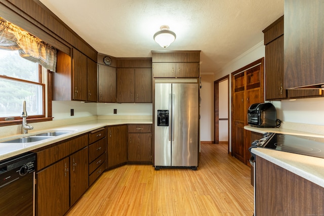 17 Old Hampton Rd, Canterbury, CT 06331 - kitchen featuring stainless steel fridge with ice dispenser, a sink, dishwasher, light wood finished floors, and light countertops