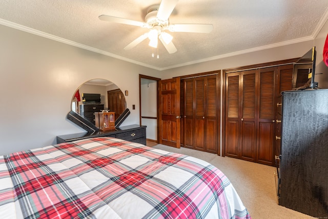 17 Old Hampton Rd, Canterbury, CT 06331 - unfurnished bedroom with a textured ceiling, light colored carpet, multiple closets, a ceiling fan, and ornamental molding