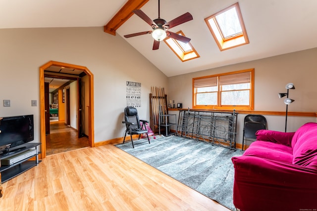 17 Old Hampton Rd, Canterbury, CT 06331 - living room featuring a skylight, wood finished floors, a ceiling fan, and baseboards