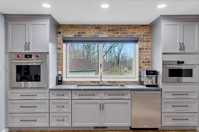 15 Briarwood Dr, Guilford, CT 06437 - kitchen featuring stainless steel appliances, dark stone countertops, and recessed lighting
