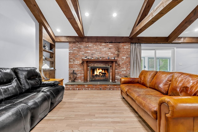 15 Briarwood Dr, Guilford, CT 06437 - living area with wood finished floors and a brick fireplace