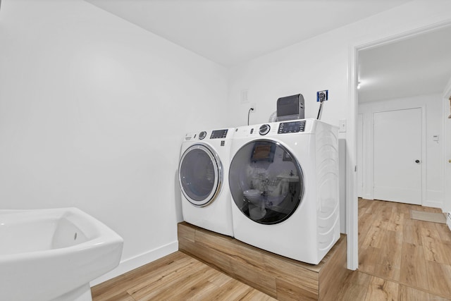 15 Briarwood Dr, Guilford, CT 06437 - laundry room featuring washing machine and clothes dryer and light wood finished floors