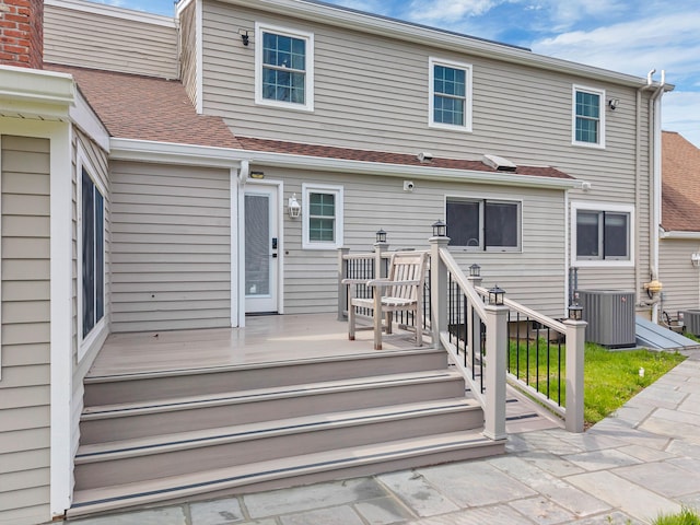 15 Briarwood Dr, Guilford, CT 06437 - rear view of property featuring a shingled roof and a wooden deck