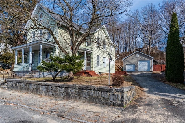 26 Columbia St, Ansonia, CT 06401 - view of side of property with a garage, driveway, and an outdoor structure