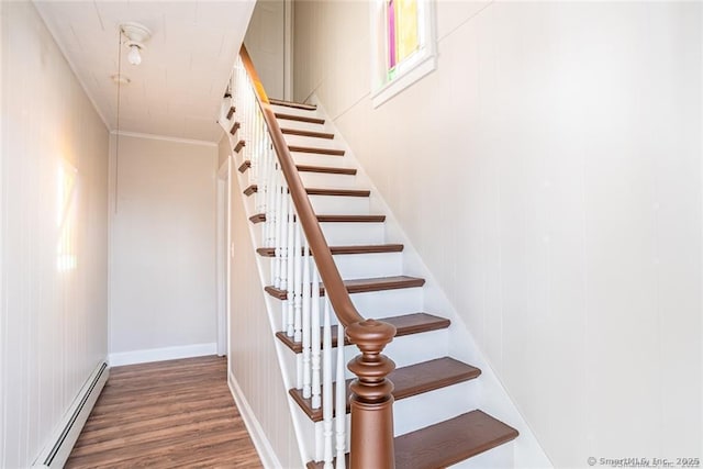 26 Columbia St, Ansonia, CT 06401 - staircase featuring a baseboard radiator, wood finished floors, and crown molding