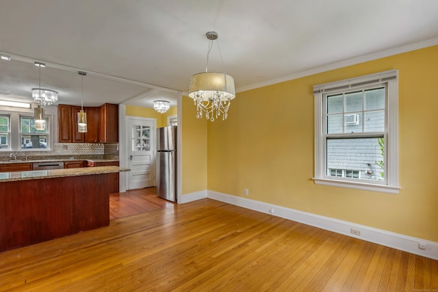 25 S Highland St, West Hartford, CT 06119 - kitchen featuring appliances with stainless steel finishes, baseboards, a chandelier, light wood finished floors, and crown molding