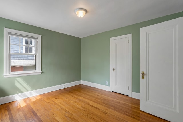 25 S Highland St, West Hartford, CT 06119 - unfurnished bedroom with baseboards and wood finished floors