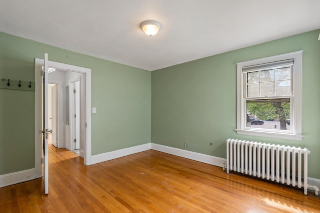 25 S Highland St, West Hartford, CT 06119 - unfurnished room with radiator, baseboards, and wood finished floors