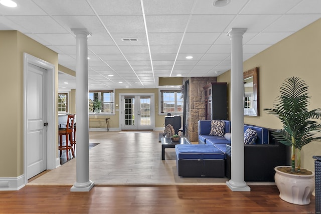 22 Nature Ln, Shelton, CT 06484 - living area with decorative columns, wood finished floors, a drop ceiling, recessed lighting, and baseboards