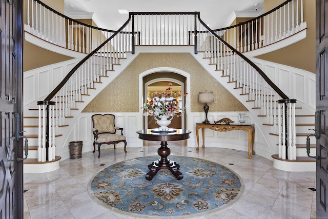 22 Nature Ln, Shelton, CT 06484 - entrance foyer with a decorative wall, stairs, a high ceiling, marble tiled flooring, and crown molding