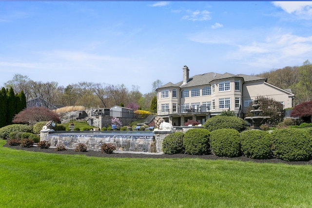 22 Nature Ln, Shelton, CT 06484 - rear view of property featuring a chimney and a lawn