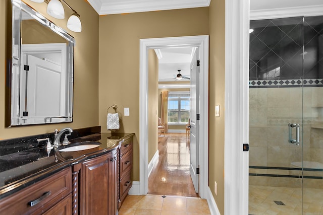 22 Nature Ln, Shelton, CT 06484 - bathroom with ornamental molding, vanity, a ceiling fan, a shower stall, and tile patterned floors