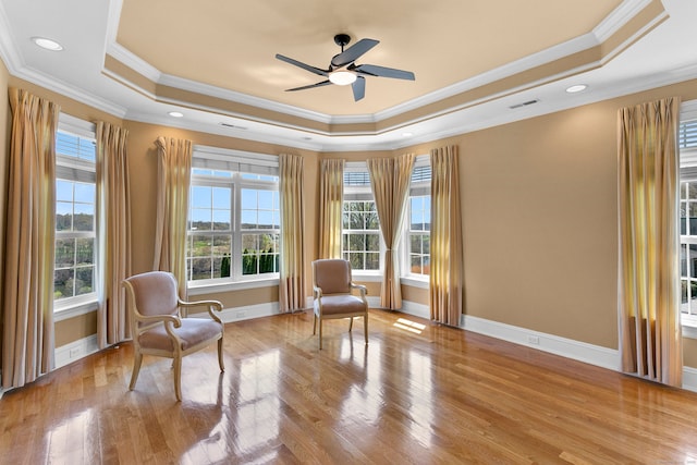 22 Nature Ln, Shelton, CT 06484 - living area with a tray ceiling, ornamental molding, wood finished floors, a ceiling fan, and baseboards