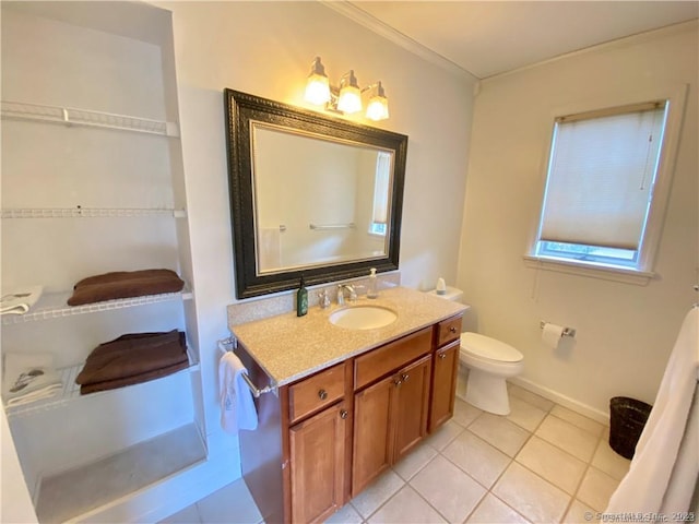 bathroom with vanity, tile patterned floors, baseboards, and toilet