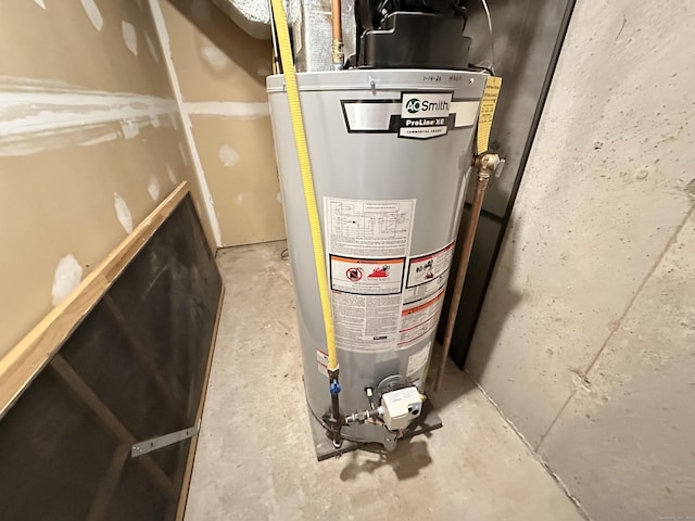utility room featuring water heater