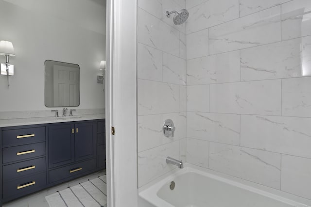 full bathroom featuring vanity and  shower combination