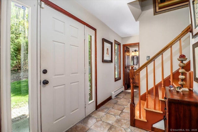 entryway with a baseboard radiator, plenty of natural light, stairway, and baseboards