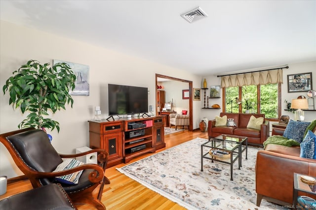 living room with wood finished floors