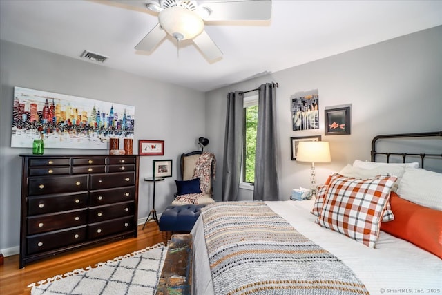 bedroom featuring wood finished floors and a ceiling fan