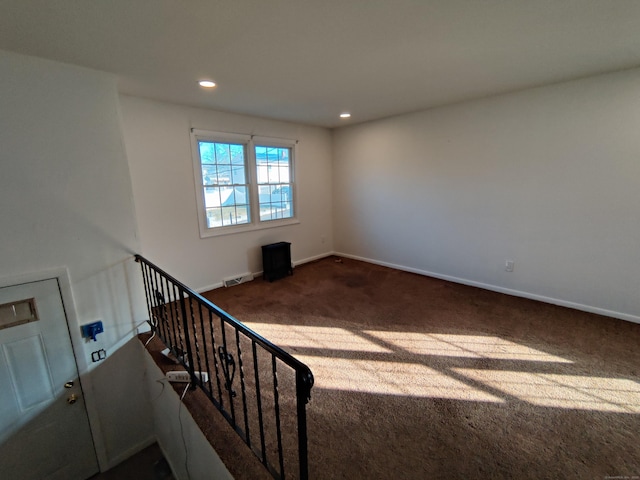 interior space with baseboards, visible vents, and recessed lighting