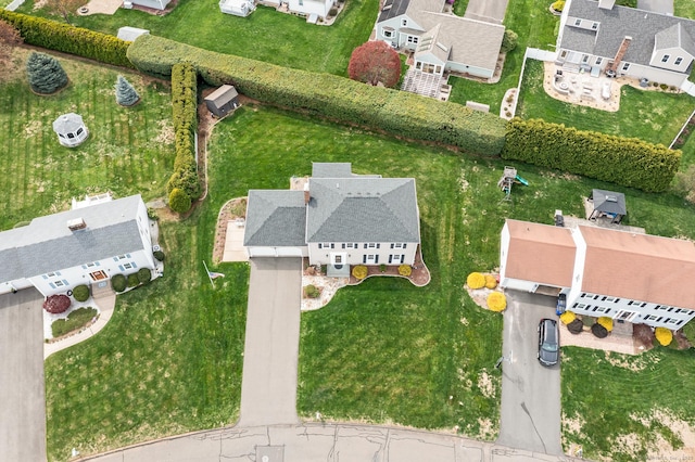birds eye view of property with a residential view