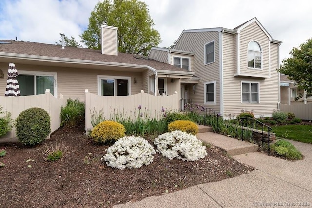 443 Lakeview Dr Unit 443, Southington, CT 06489 - view of property with a chimney and fence
