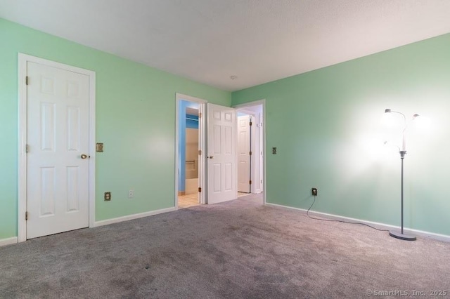 443 Lakeview Dr Unit 443, Southington, CT 06489 - unfurnished bedroom with carpet, baseboards, and connected bathroom