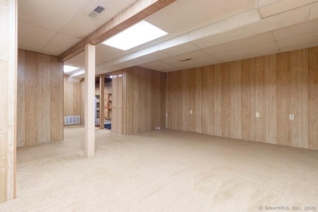 443 Lakeview Dr Unit 443, Southington, CT 06489 - finished basement with a paneled ceiling, wood walls, and carpet flooring
