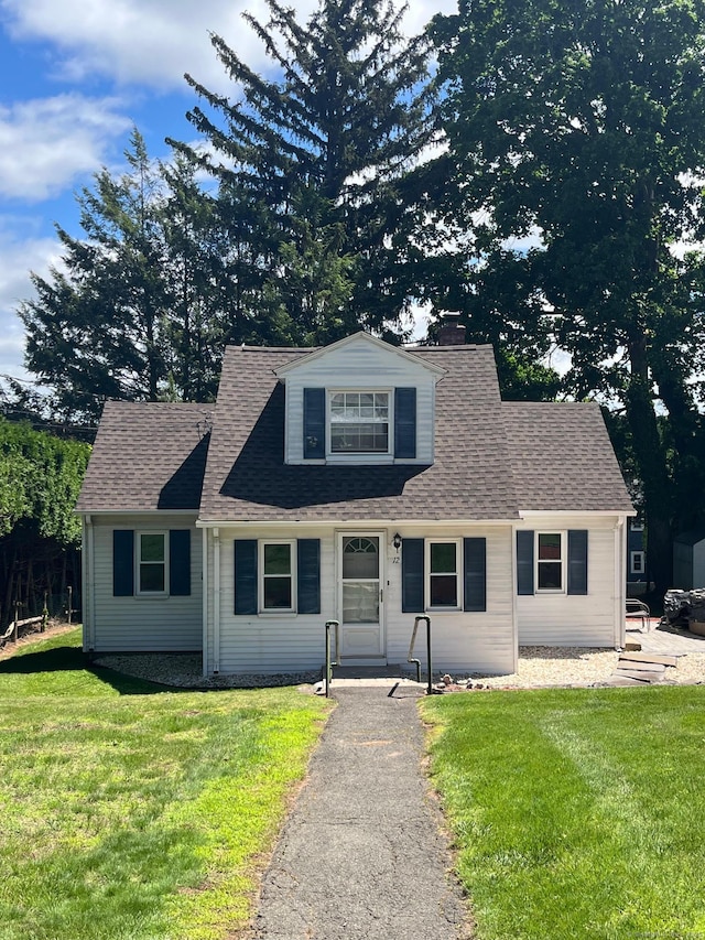 12 Homecrest St, Newington, CT 06111 - view of front of house featuring a front yard, a chimney, and roof with shingles