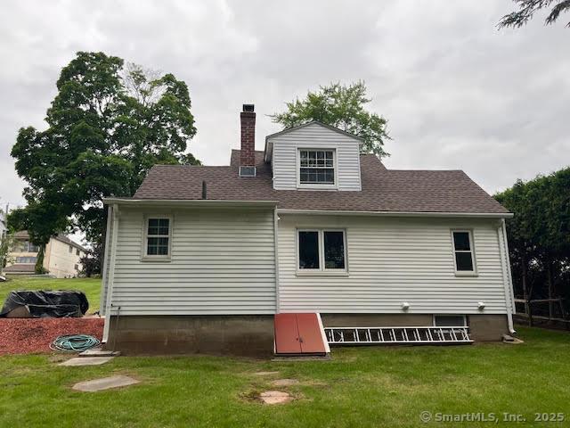 12 Homecrest St, Newington, CT 06111 - rear view of property featuring a chimney, a lawn, and roof with shingles
