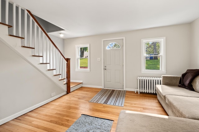 12 Homecrest St, Newington, CT 06111 - entryway with radiator, light wood-style flooring, and stairway