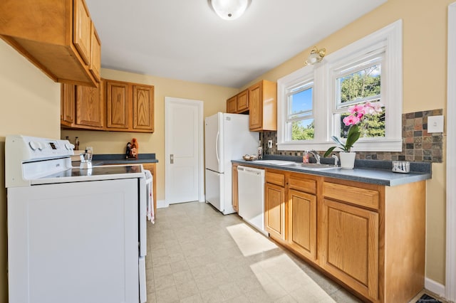 12 Homecrest St, Newington, CT 06111 - kitchen featuring white appliances, dark countertops, light flooring, and tasteful backsplash