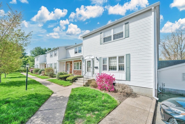 view of front of home with a front lawn