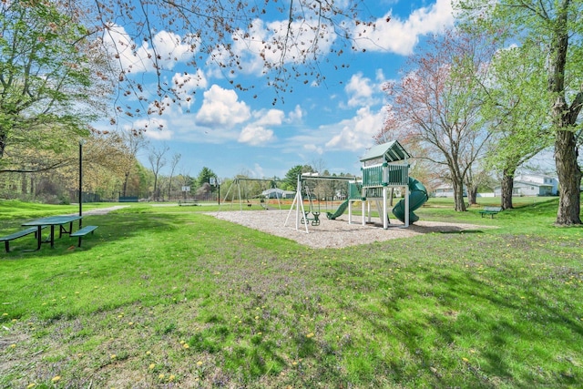 communal playground featuring a lawn