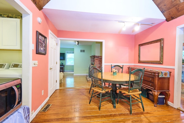 581 Oxford Rd, Oxford, CT 06478 - dining space featuring washer and dryer, light wood-style flooring, rail lighting, and baseboards