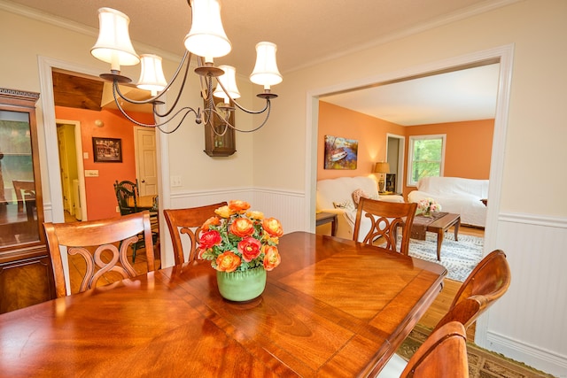 581 Oxford Rd, Oxford, CT 06478 - dining space with crown molding, a wainscoted wall, and a chandelier