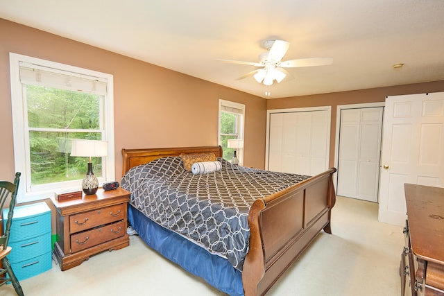 581 Oxford Rd, Oxford, CT 06478 - bedroom with light carpet, two closets, and ceiling fan