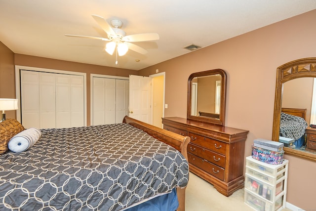 581 Oxford Rd, Oxford, CT 06478 - carpeted bedroom featuring two closets and a ceiling fan