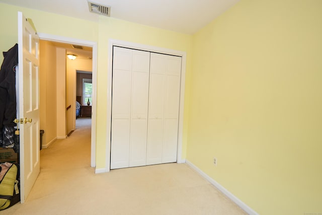 581 Oxford Rd, Oxford, CT 06478 - unfurnished bedroom with light carpet, baseboards, and a closet