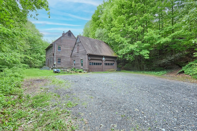 581 Oxford Rd, Oxford, CT 06478 - view of property exterior featuring a detached garage and a chimney