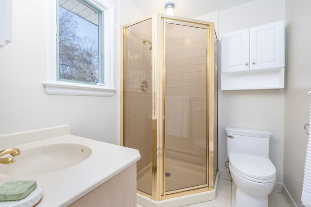 bathroom with toilet, a stall shower, tile patterned flooring, and vanity