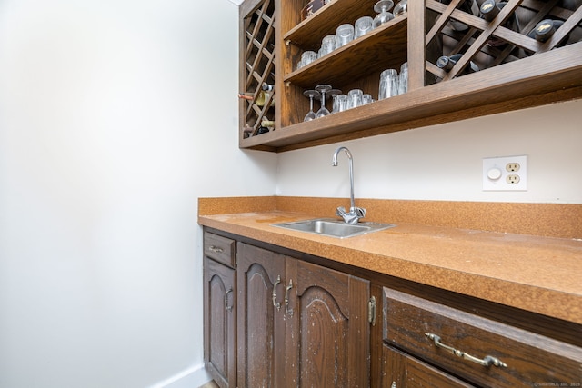 bar with wet bar and a sink