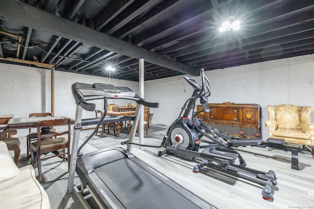 exercise area with wood finished floors
