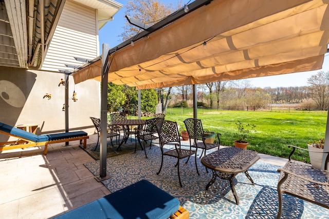 view of patio with a pergola and outdoor dining area